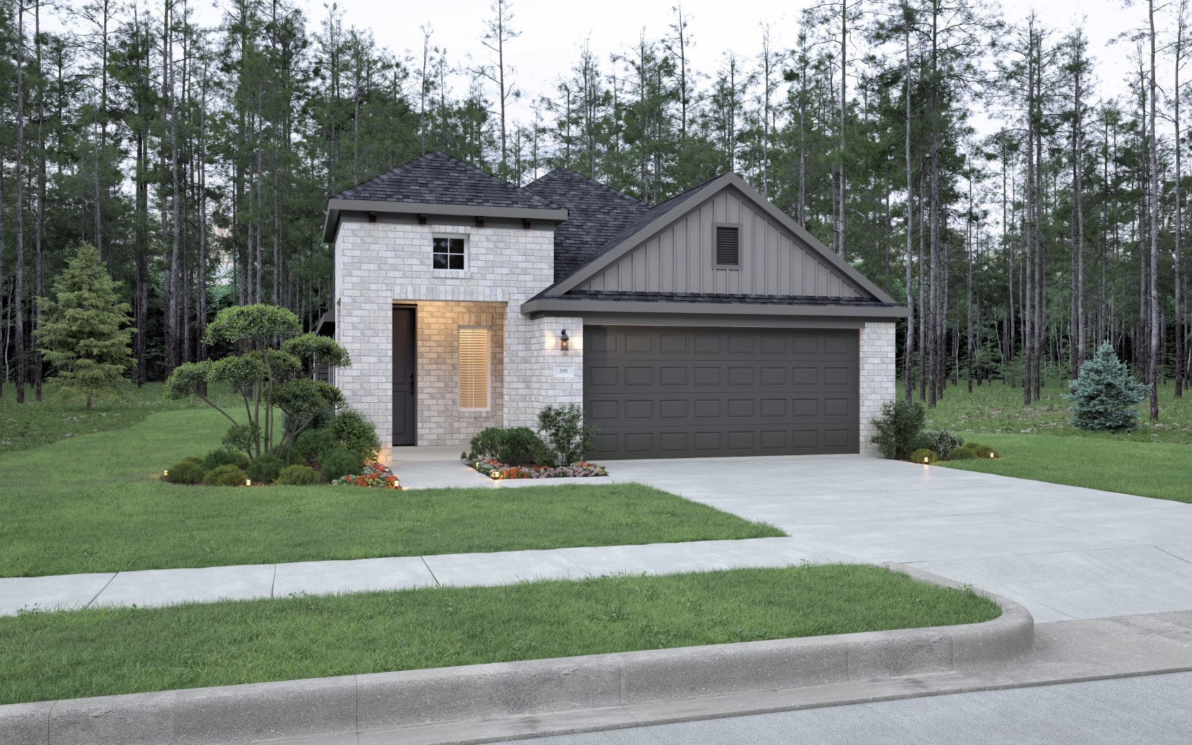 A modern single-story house with stone and wood exterior, a dark two-car garage, manicured lawn, small shrubs, and a concrete driveway, set against a backdrop of tall trees.