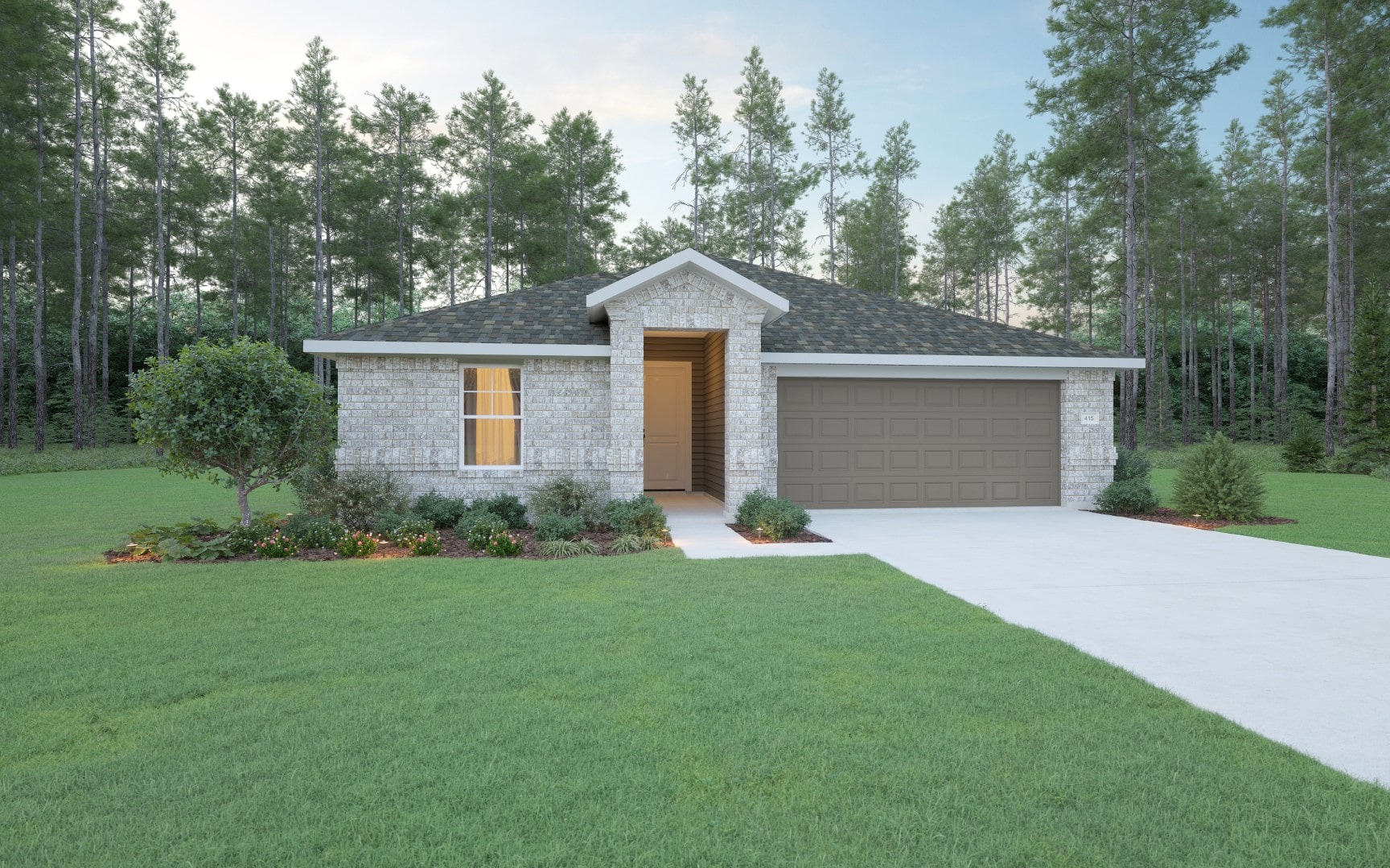 Single-story modern house with light brick exterior, gray shingle roof, two-car garage, and a front porch. Surrounded by a green lawn, small shrubs, and trees, with a forested area in the background.