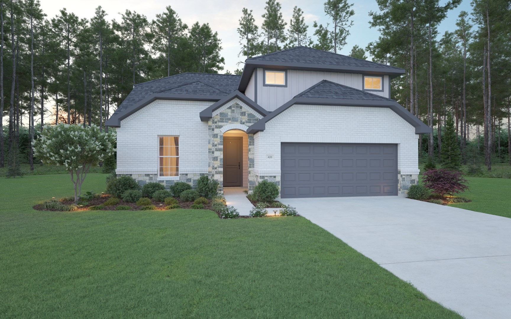 A modern two-story house with white brick and gray accents, a two-car garage, manicured lawn, landscaped plants, and trees in the background at sunset.