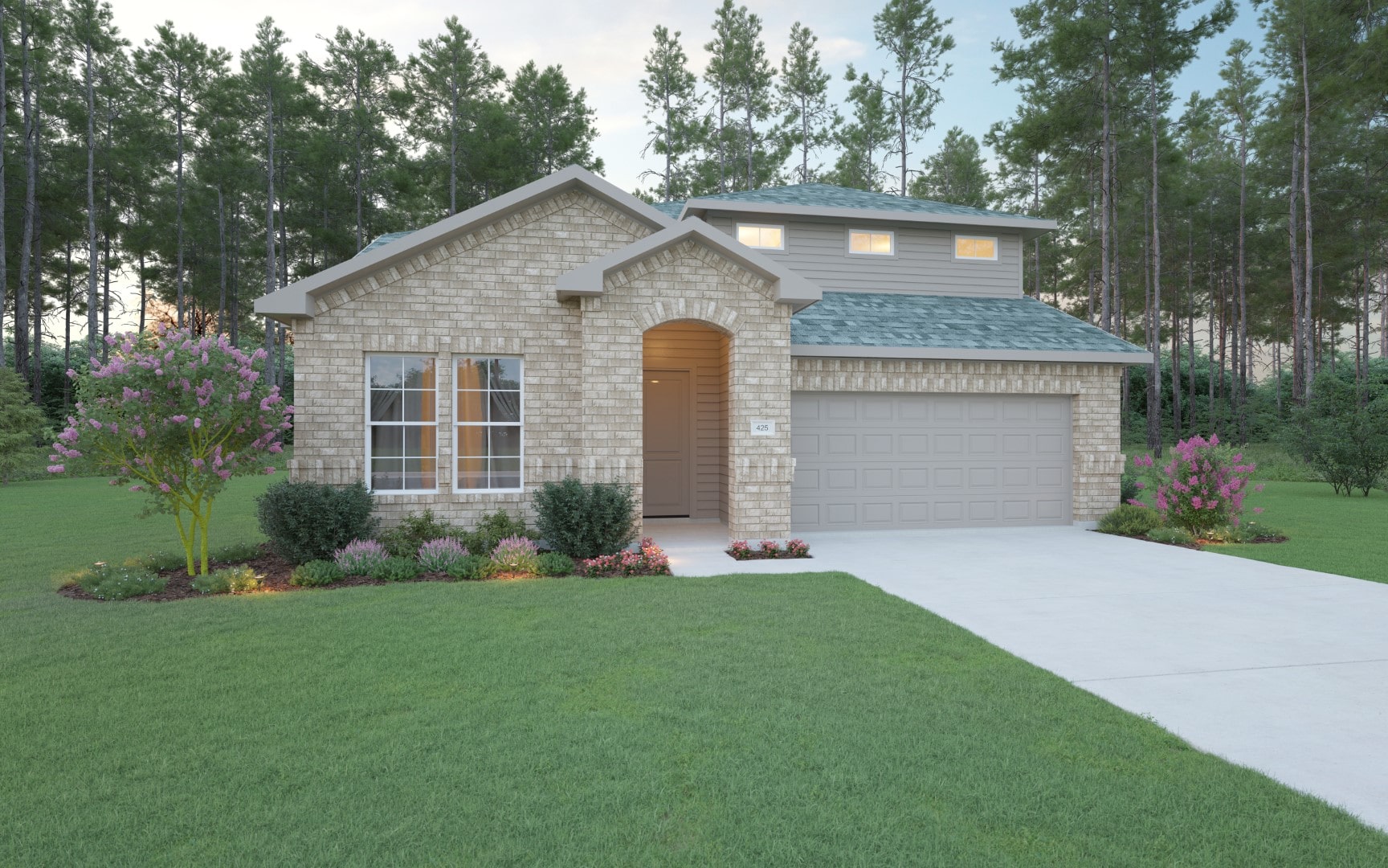 A modern two-story brick house with a double garage, manicured lawn, flower beds, and surrounded by tall pine trees in the background under a partly cloudy sky.