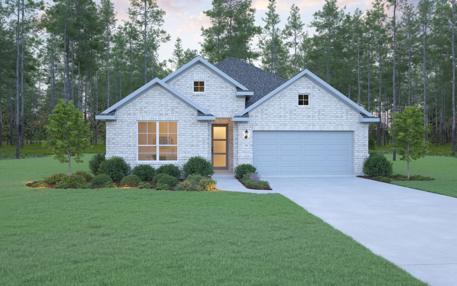 Single-story brick house with a gray roof and double garage, surrounded by a well-kept lawn, trimmed bushes, small trees, and a backdrop of tall pine trees.