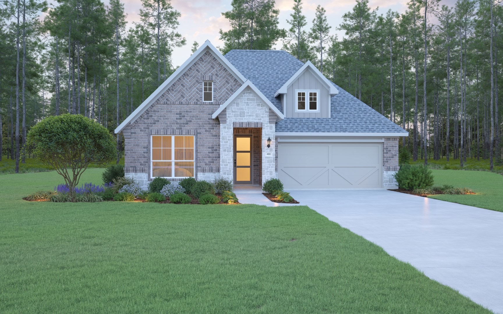 A modern single-story brick house with a gray roof, large front window, double garage, and well-kept lawn and landscaping, surrounded by tall pine trees at dusk.