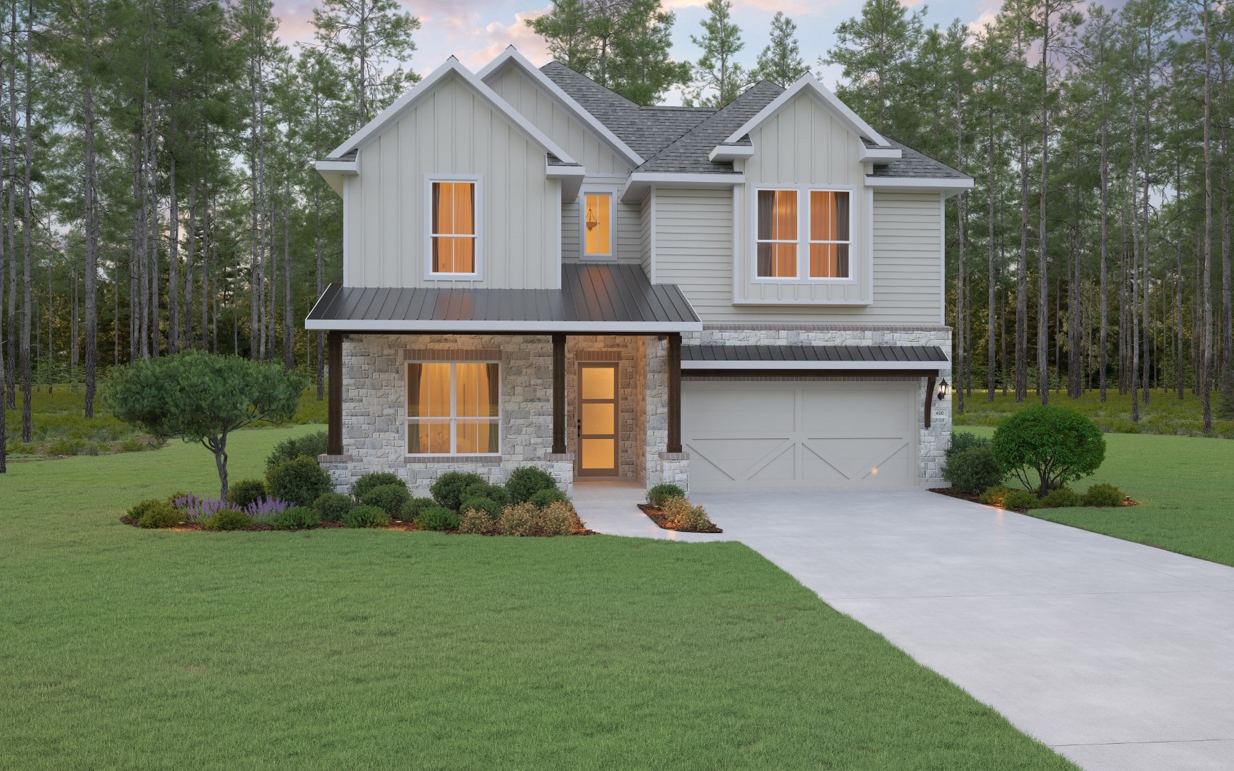 Two-story house with gray siding, stone accents, and a covered front porch. The home has a double garage, neatly landscaped yard, and is surrounded by tall trees in the background.