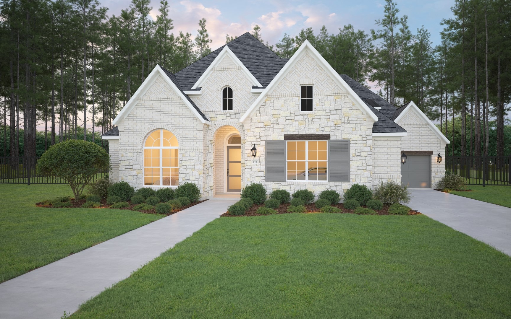 A modern, white brick house with a front porch, large arched window, manicured lawn, shrubs, and two driveways leading to a single garage. Tall pine trees border the backyard.
