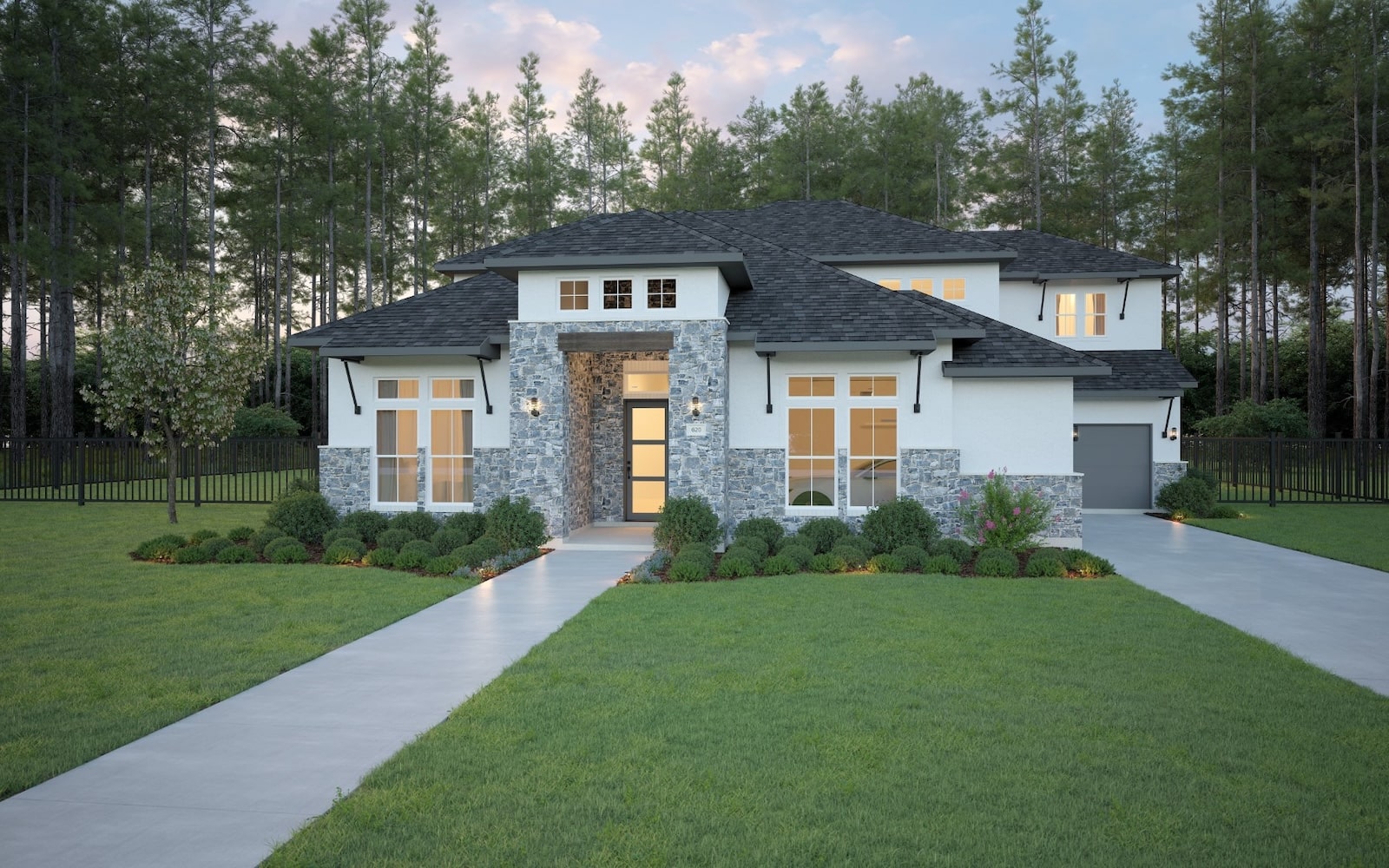 Modern two-story house with white walls, stone accents, large windows, and a dark roof, surrounded by a manicured lawn, shrubs, and trees, with a concrete walkway leading to the front entrance.